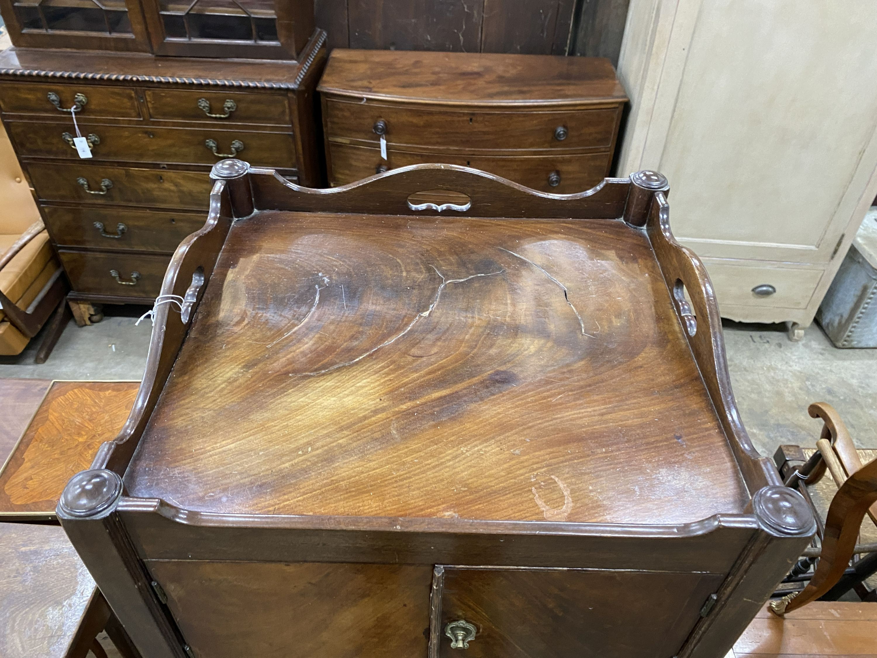 A George III mahogany tray topped bedside cupboard, width 52cm, depth 47cm, height 79cm